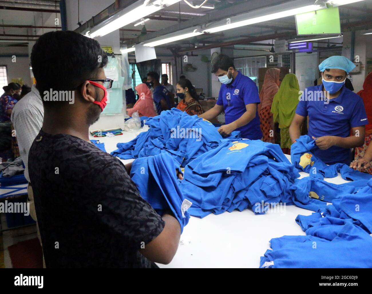 August 05,2021,Dhaka,Bangladesh Garment workers work at a factory after garment factories