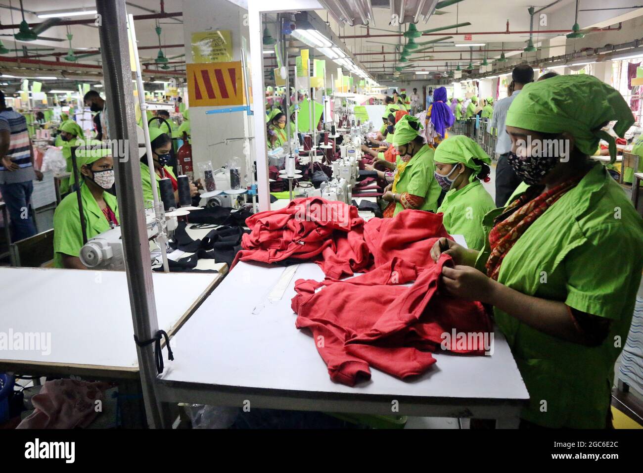 August 05,2021,Dhaka,Bangladesh: Garment workers work at a factory after garment factories reopened during Covid-19 lockdown in Dhaka Stock Photo