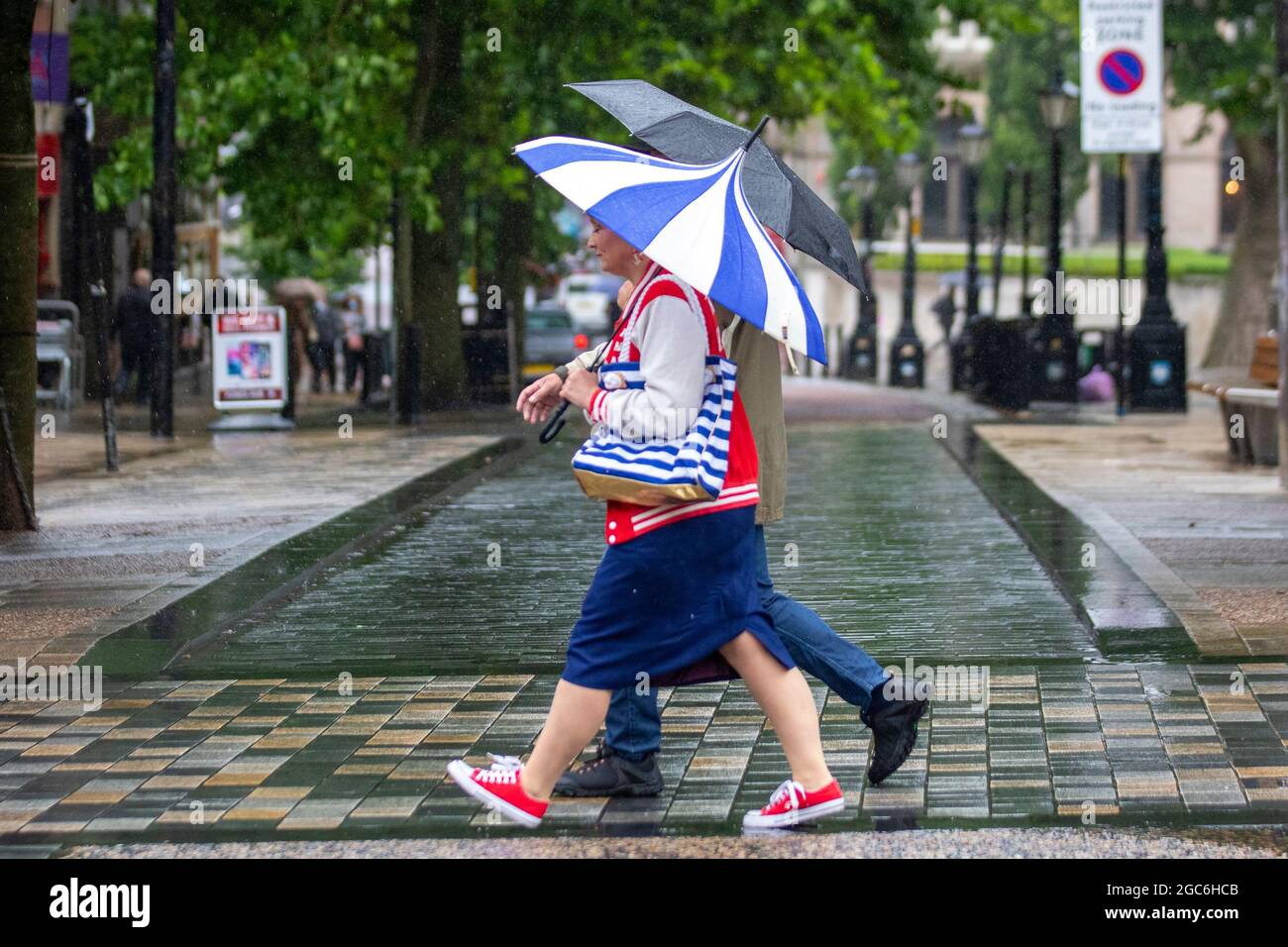Preston, Lancashire. Uk Weather. 7 Aug 2021. City centre shops, shopping and shoppers on a wet