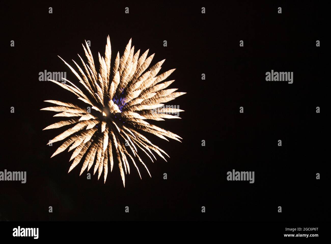 Exploding firework producing a beautiful cascading colourful display Stock Photo