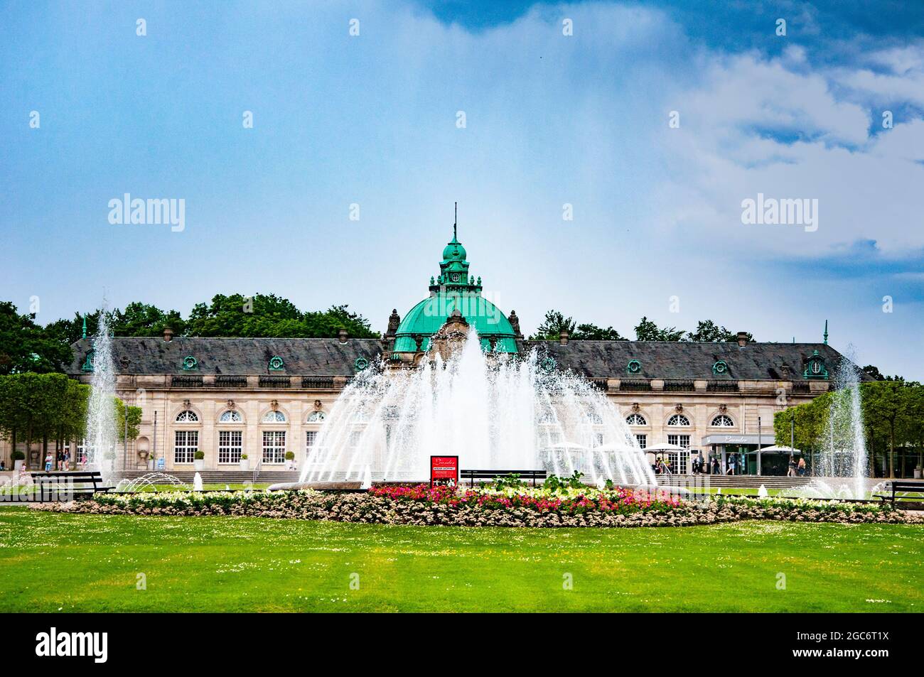 BAD OEYNHAUSEN, GERMANY. JUNE 03, 2021. Kurpark Bad Oeynhausen. Beautiful architecture in traditional style, large fountain in front of the building. Stock Photo