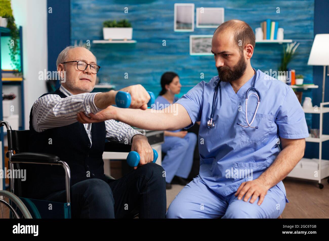 Physiotherapist nurse worker exercising physiotherapy strength exercise