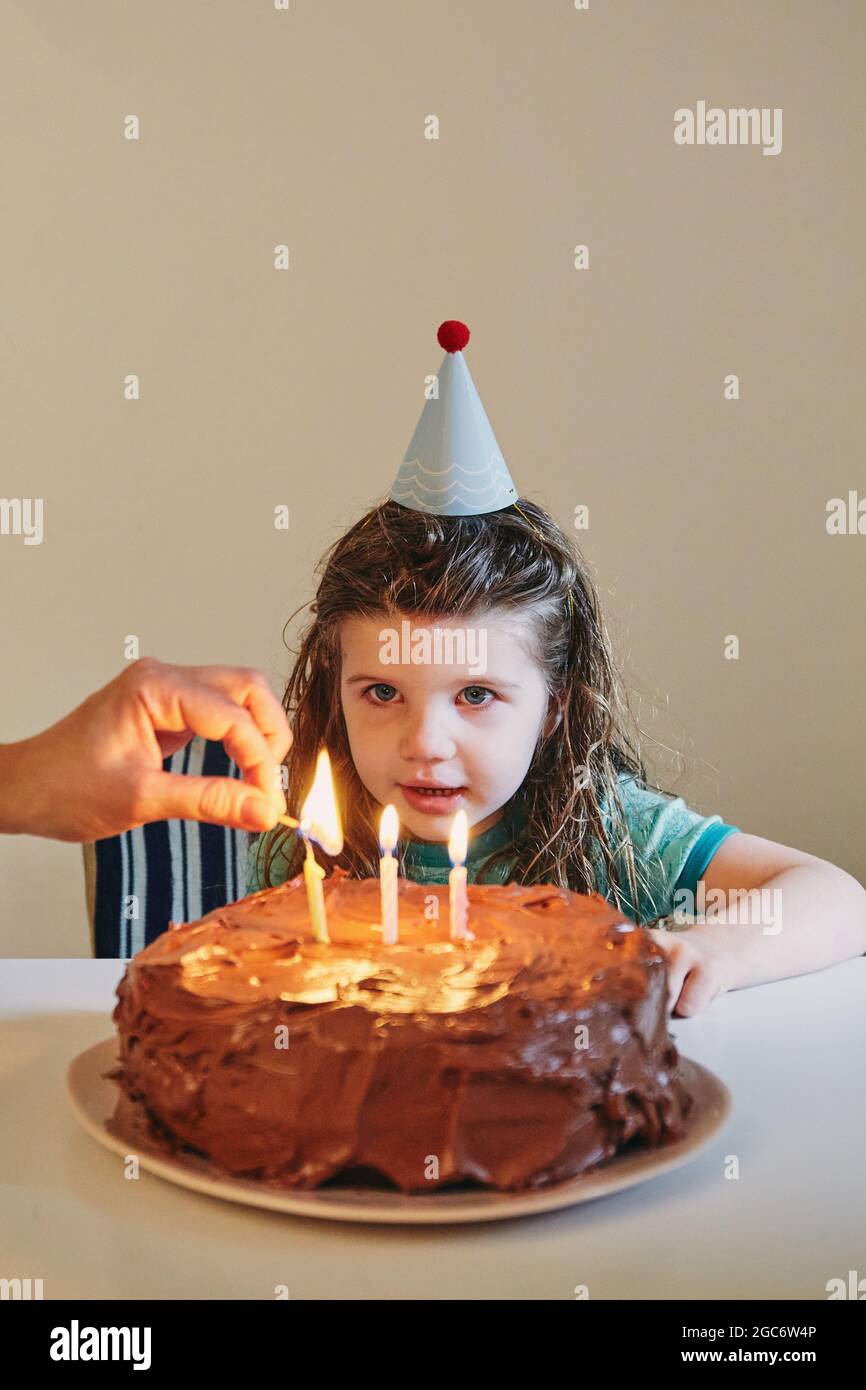 Girl celebrating her third birthday Stock Photo