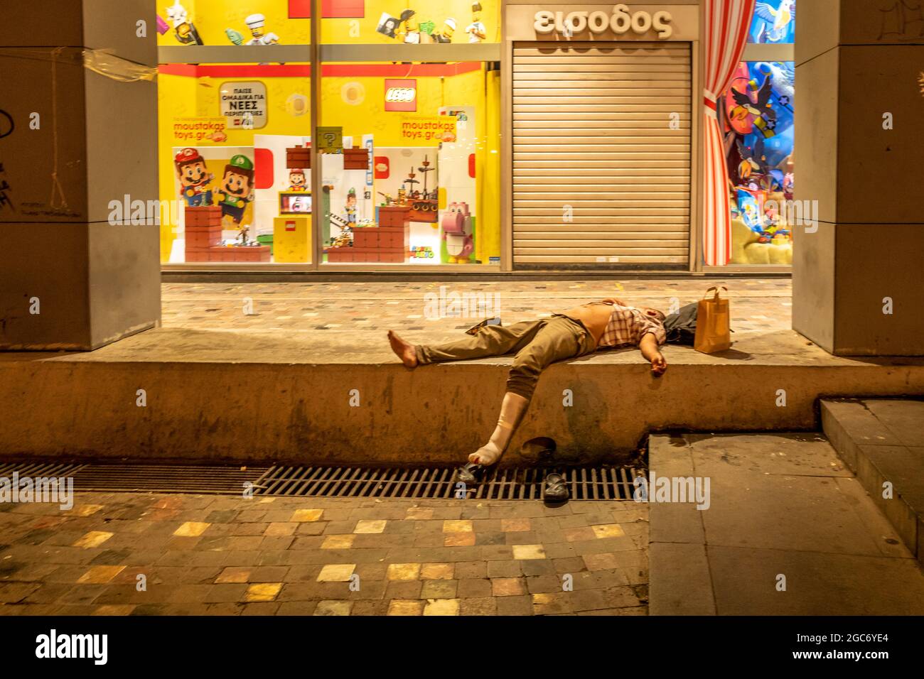 Athens, August 2nd 2021: A homeless person sleeping in Monastiraki ...