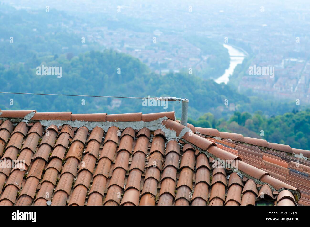 safety on construction sites: roof with lifeline and brick tiles, safety  hook for those who work on the roof, on the upper pitch near the ridge  tiles Stock Photo - Alamy