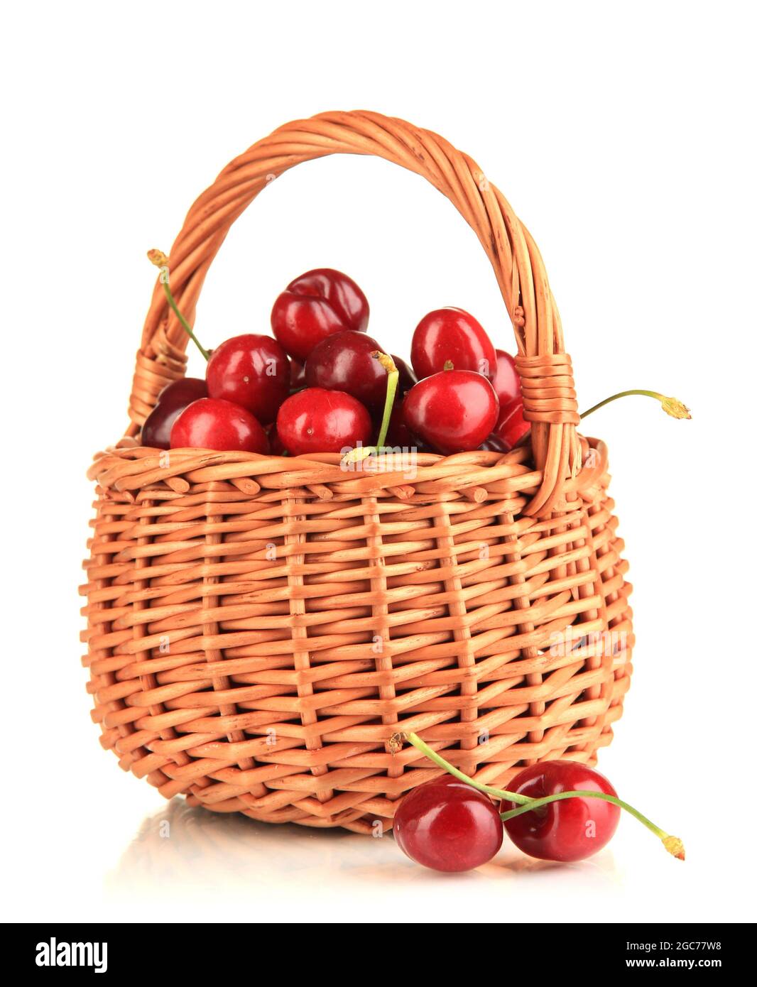 Ripe red cherry berries in basket isolated on white Stock Photo Alamy
