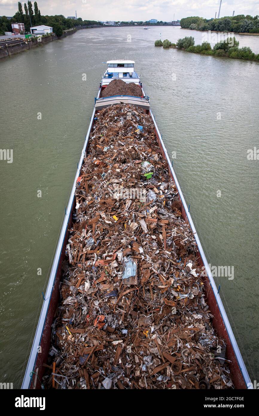 cargo ship with scrap metal entering the Rhine port Niehl, Cologne, Germany.  Frachtschiff mit Altmetall faehrt in den Niehler Hafen, Koeln, Deutschla Stock Photo