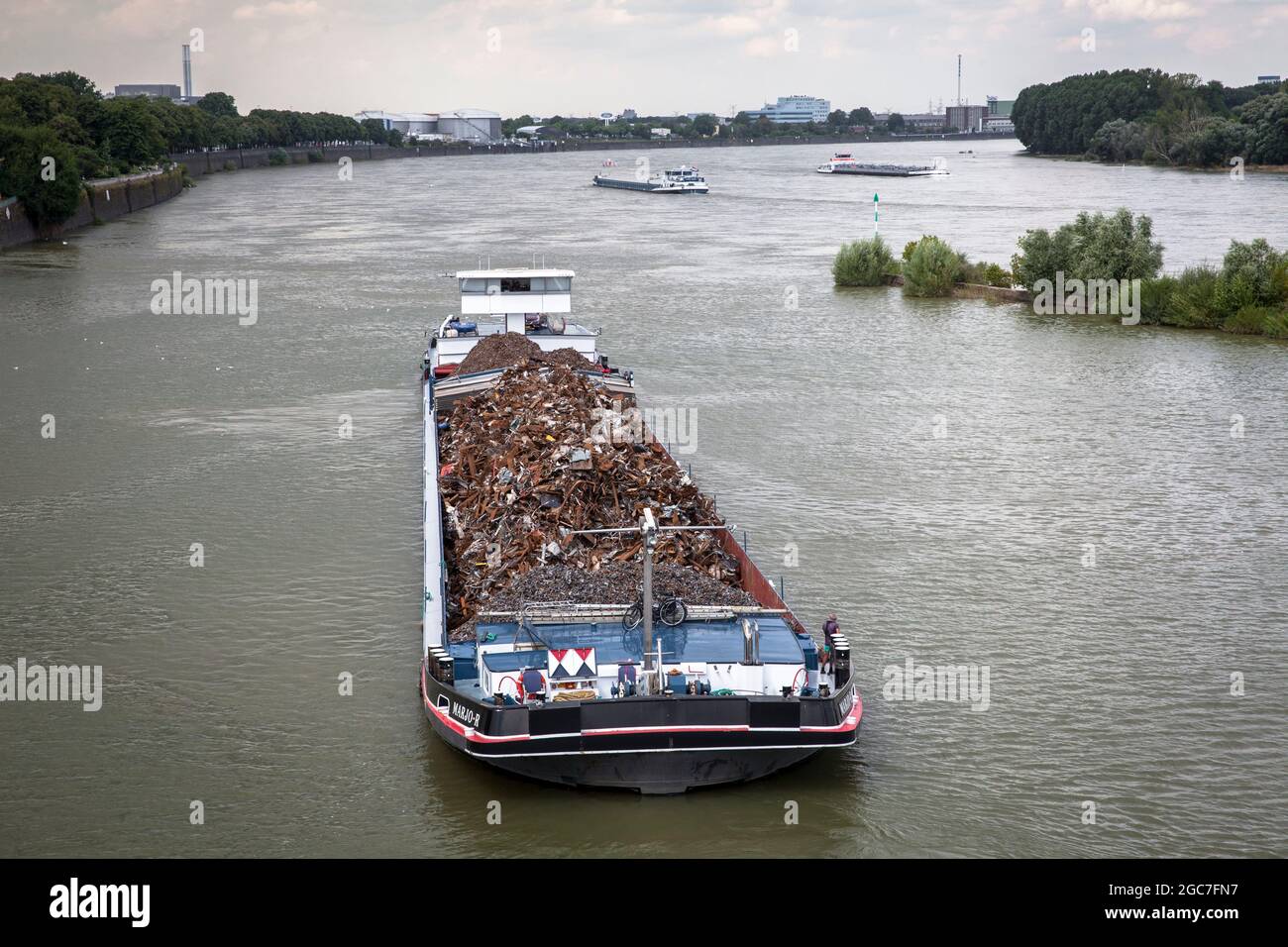 cargo ship with scrap metal entering the Rhine port Niehl, Cologne, Germany.  Frachtschiff mit Altmetall faehrt in den Niehler Hafen, Koeln, Deutschla Stock Photo