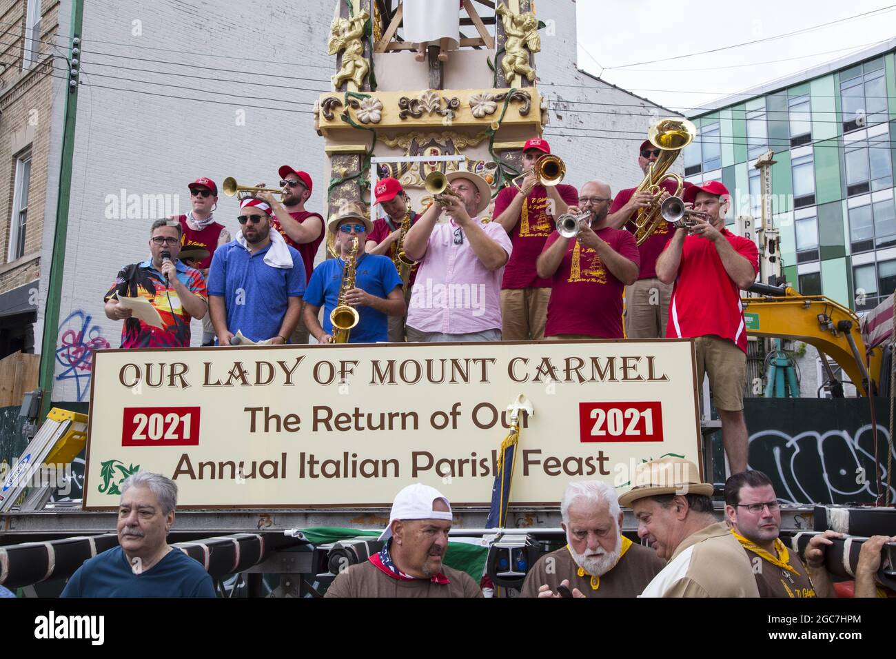 People of all ethnicities crowd North 8th Street at the annual Italian Giglio Feast and 4 ton