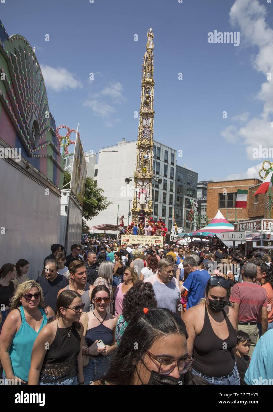 People of all ethnicities crowd North 8th Street at the annual Italian Giglio Feast and 4 ton