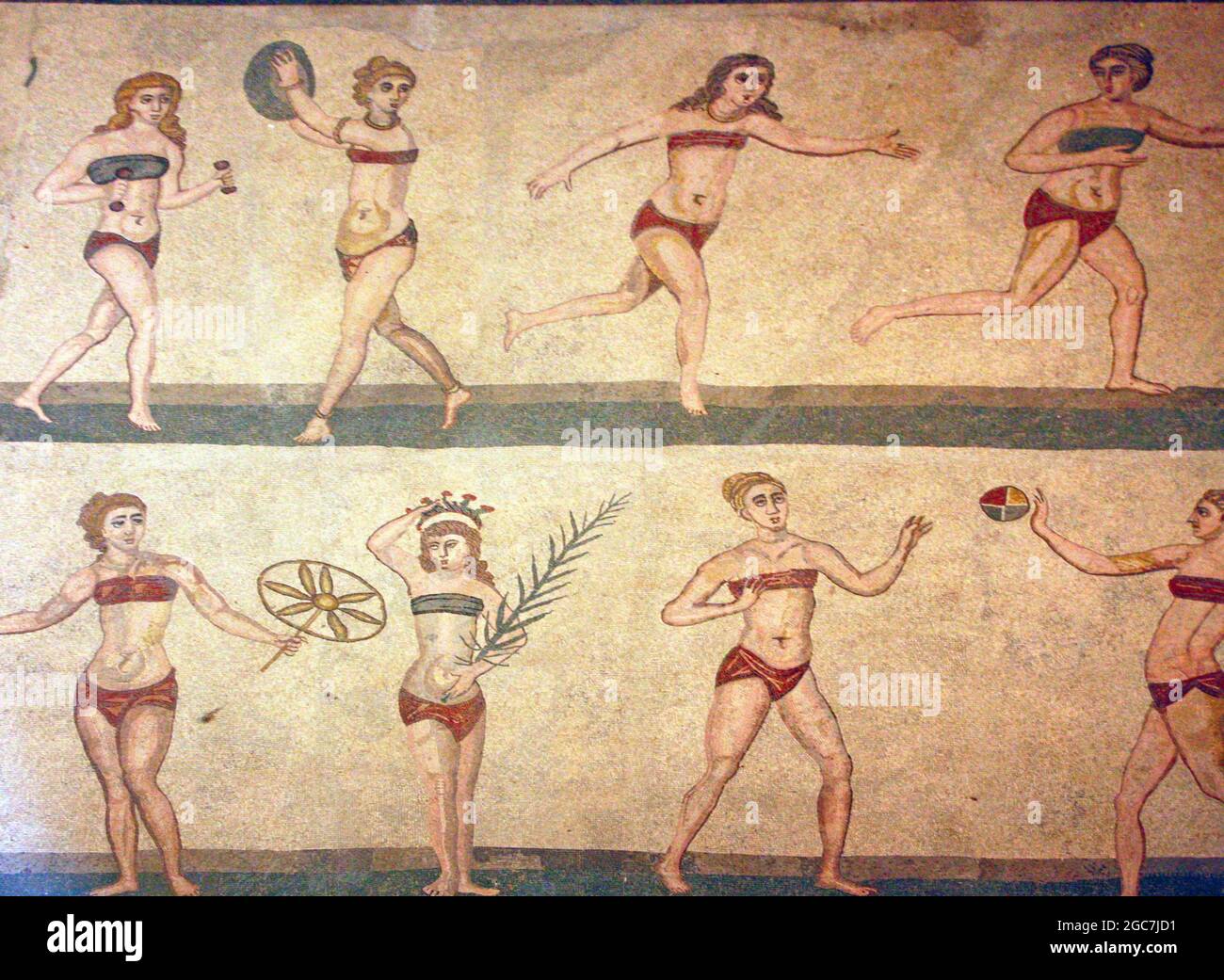 Roman Bikini Mosaics at The Villa Romana del Casale, Sicily, Italy. Early depiction of Roman women wearing bikinis from early 4th century AD. Stock Photo