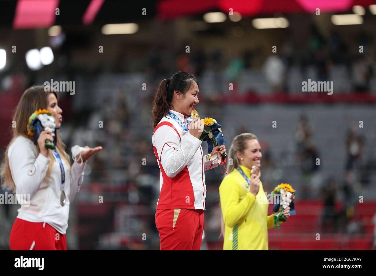 Tokyo, Japan. 7th Aug, 2021. Gold medalist Liu Shiying (C) of China, silver medalist Maria Andrejczyk (L) of Poland and bronze medalist Kelsey-Lee Barber of Australia react during the awarding ceremony of the Women's Javelin Throw at the Tokyo 2020 Olympic Games in Tokyo, Japan, Aug. 7, 2021. Credit: Li Ming/Xinhua/Alamy Live News Stock Photo