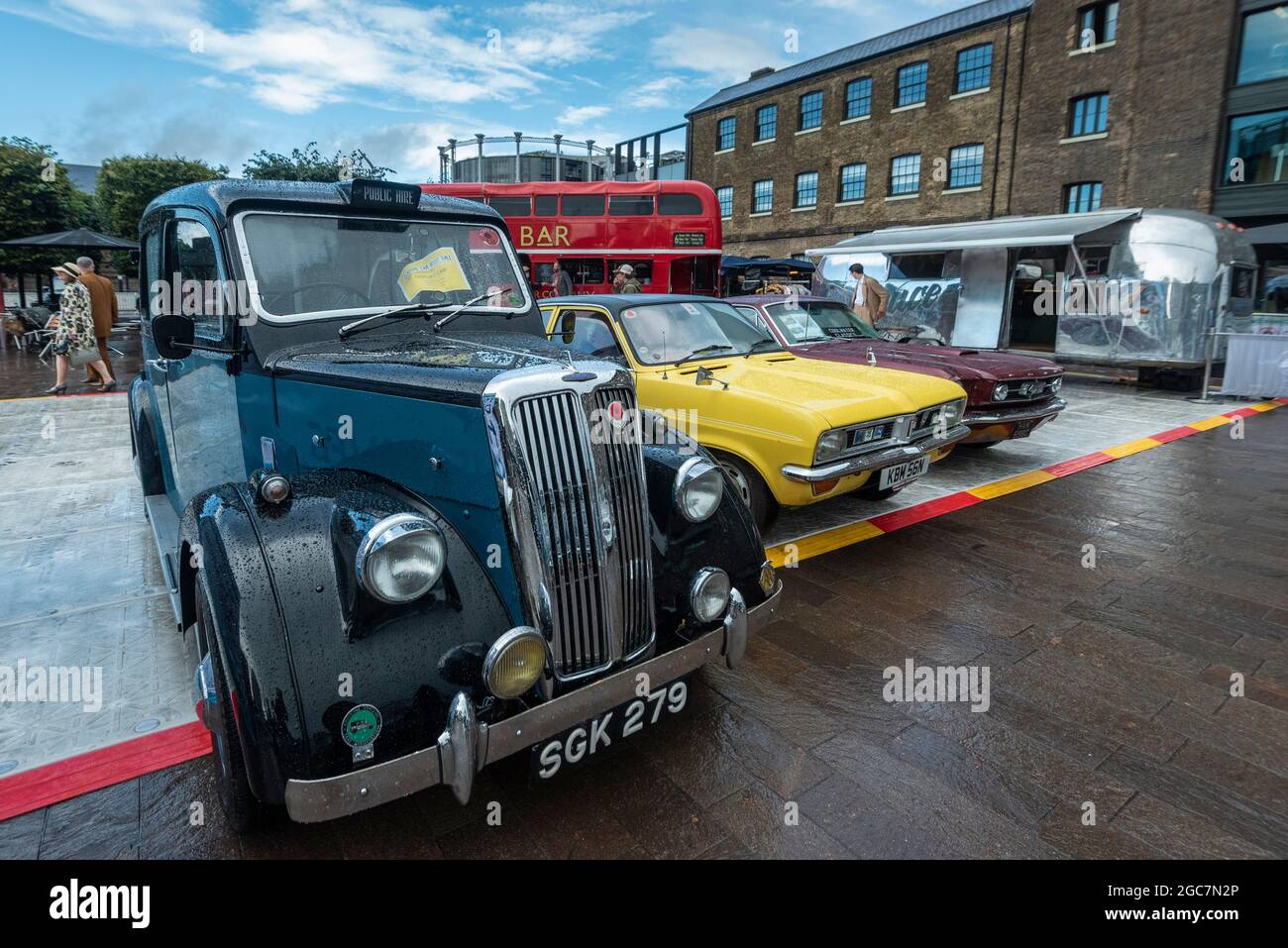 London, UK.  7 August 2021. Vintage cars on show at the Classic Car Boot Sale in Granary Square, King’s Cross.  The event celebrates all things vintage from fashion and jewellery to homeware and vinyl records.  Over 100 vintage vehicles are also on display.  Credit: Stephen Chung / Alamy Live News Stock Photo