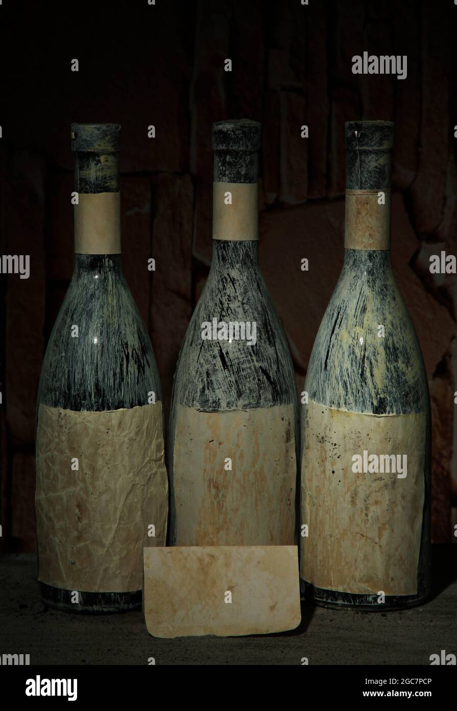 Old bottles of wine in old cellar, on dark background Stock Photo Alamy