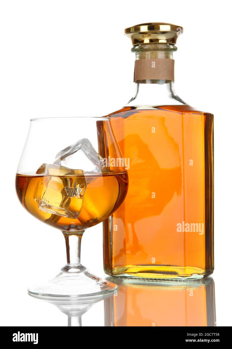 Glass of brandy and bottle isolated on white Stock Photo Alamy