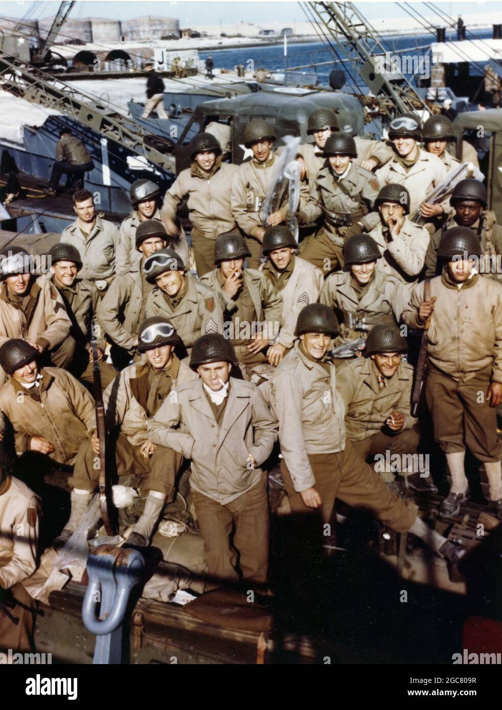 ENGLAND, UK - 4-5 June 1944 - In an unidentified port on the south coast of England, these American troops have loaded their equipment onto an LCT and Stock Photo
