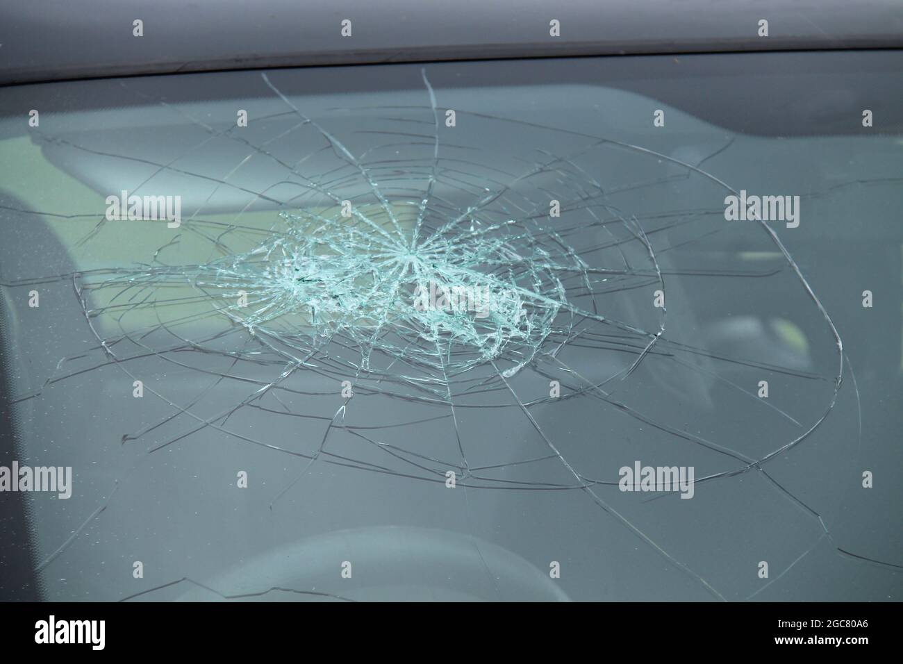 The Smashed Windscreen of a Family Saloon Car. Stock Photo