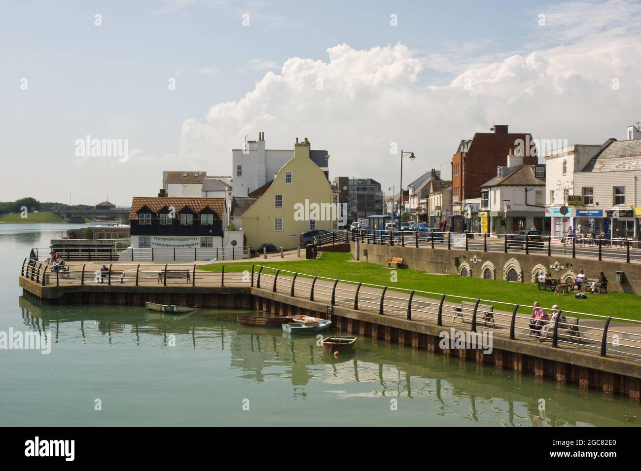 River Adur waterfront at Shoreham, West Sussex, England with people on promenade and street. Stock Photo