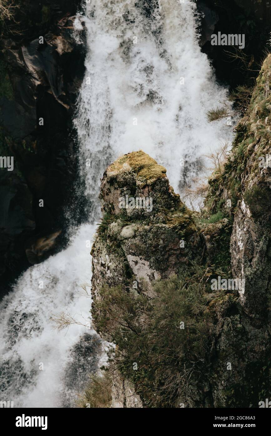 Vertical shot of a waterfall in a rocky area Stock Photo - Alamy