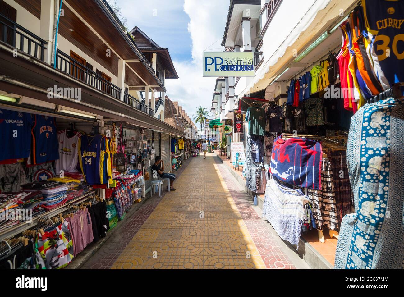 KO PHI PHI, THAILAND, 31ST MARCH 2017: Shops and streets on Ko Phi Phi island. Merchandise and people can be seen. Stock Photo