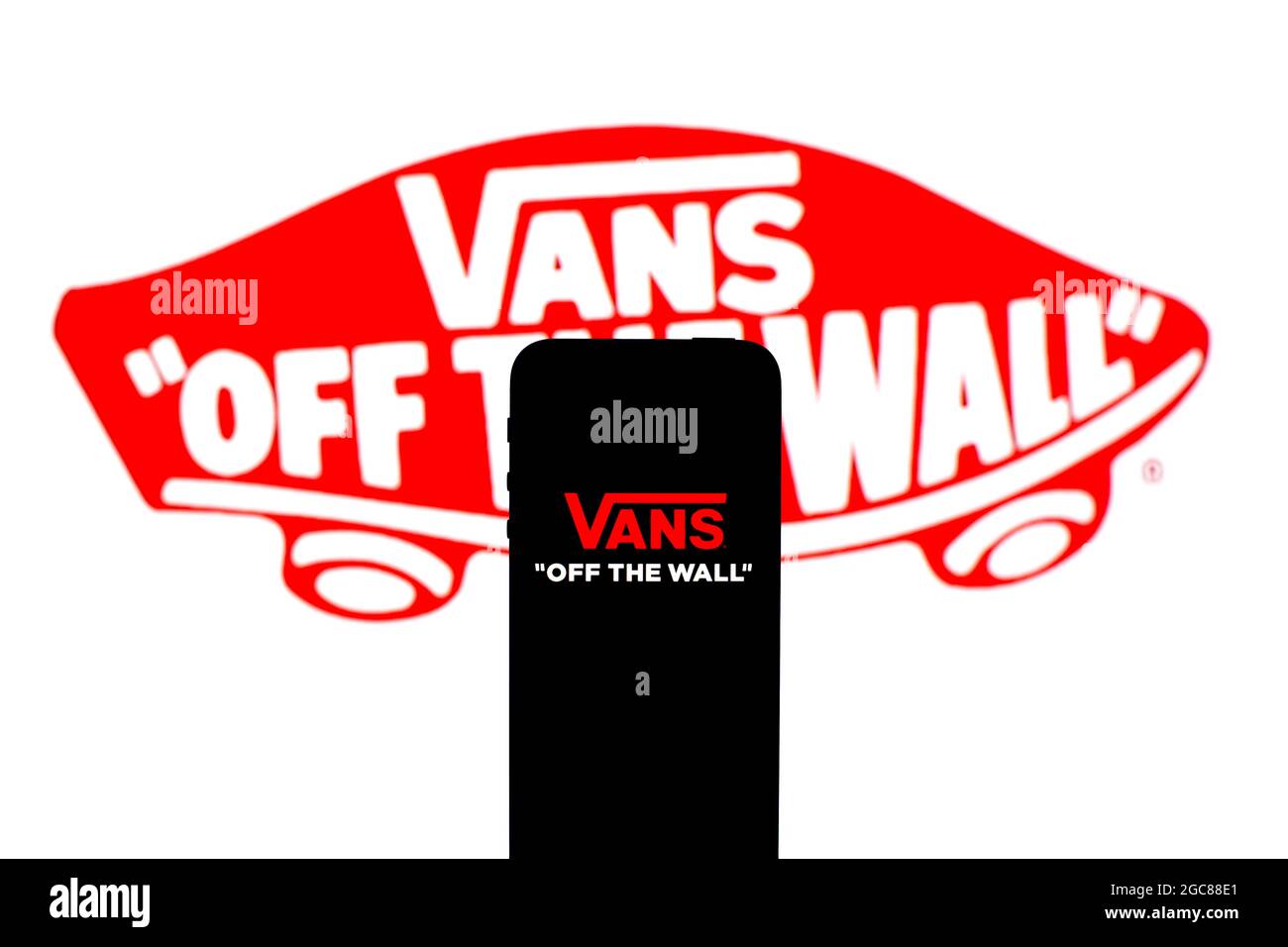 Barcelona, Catalonia, Spain. 6th Aug, 2021. In this photo illustration, a  Vans logo seen displayed on a smartphone with a Vans logo in the  background. (Credit Image: © Thiago Prudencio/DAX via ZUMA