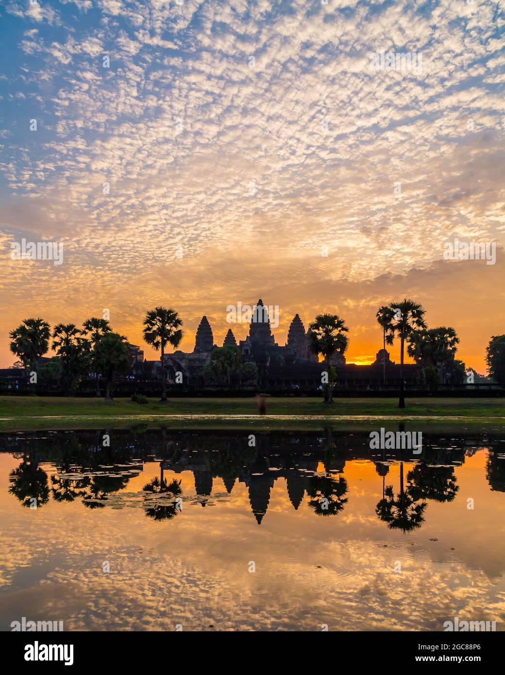 Sunrise at the Angkor Wat temple complex in Cambodia showing beautiful colours and reflections Stock Photo