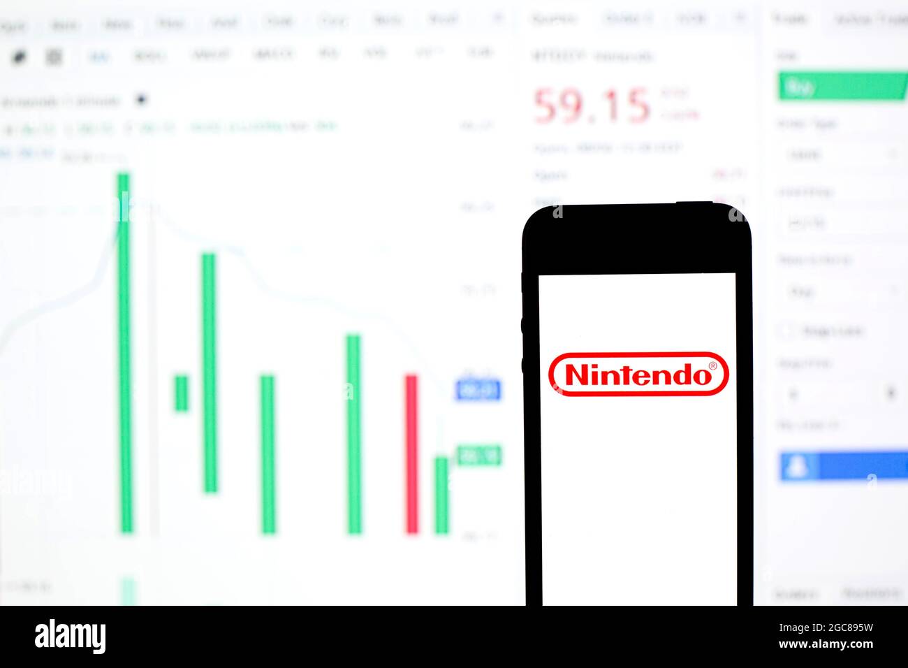 August 6, 2021, Barcelona, Catalonia, Spain: In this photo illustration a Nintendo  Co., Ltd. logo seen displayed on a smartphone with the stock market  information of Nintendo Co., Ltd. in the background. (