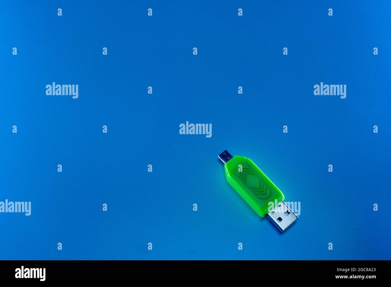 USB OTG converter green on blue background Stock Photo Alamy