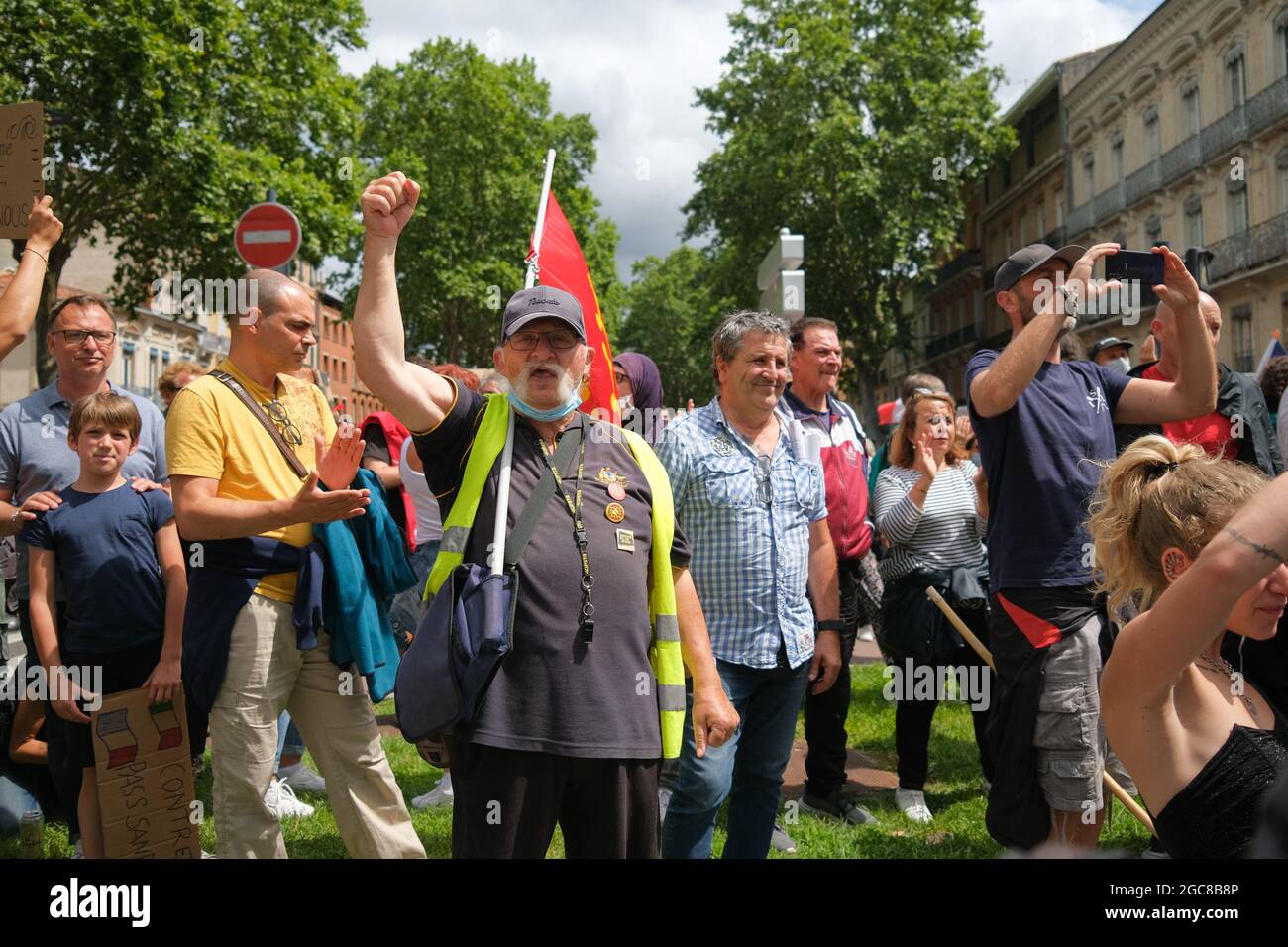 Yellow Vest Protester (Gilet Jaune). On August 7, 2021, several thousand  people defied the prefectural ban on demonstrating, marching in the streets  of Toulouse (France). Chanting the word "Freedom", and anti-Macron slogans,