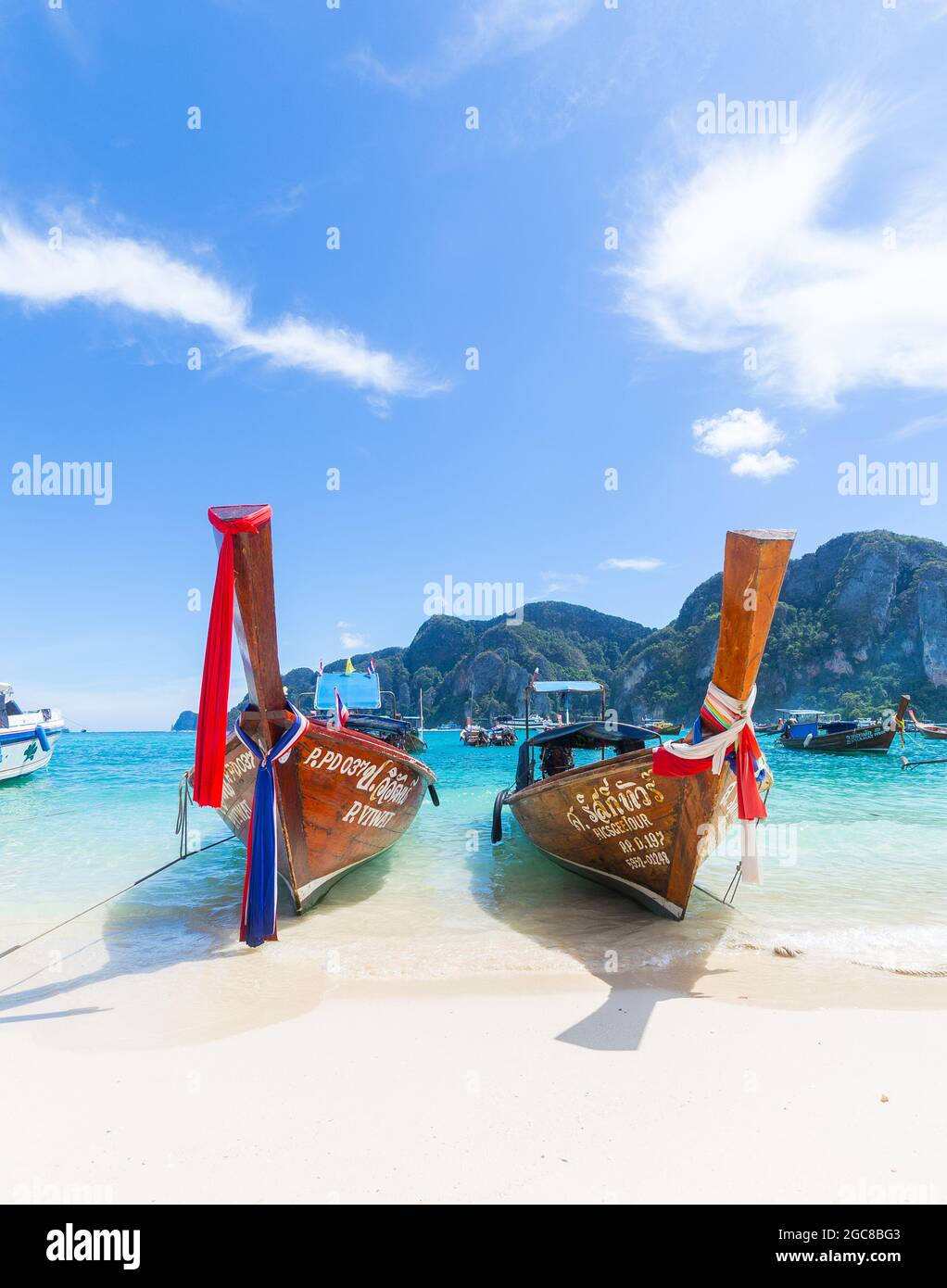 KO PHI PHI DON, THAILAND - 31ST MARCH 2017: Typical long-tail boats on the beaches in Ko Phi Phi Thailand Stock Photo