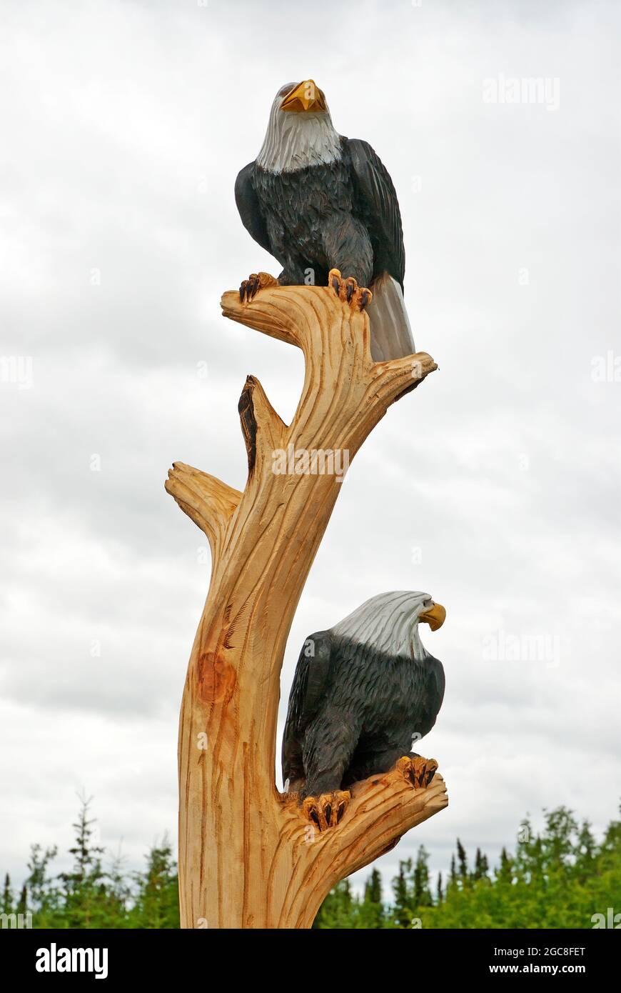 Carved in wood Bear and Salmon - alaska. Stock Photo