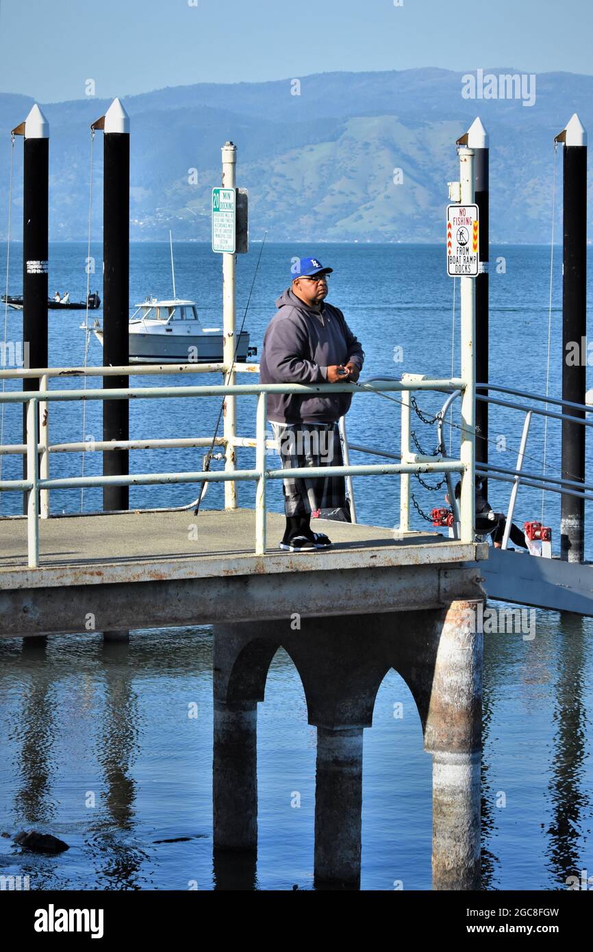 Men shore fishing at Clearlake California Stock Photo