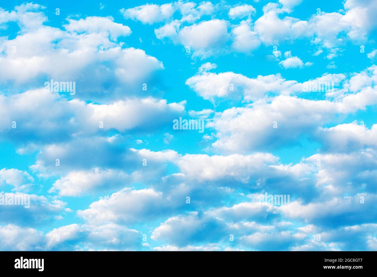 Beautiful white clouds float across the blue fairytale sky. Relaxation and relaxation Stock Photo