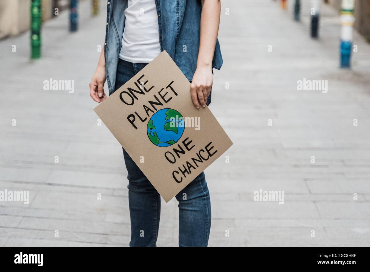 Demonstration on the city protesting against climate change and pollution - Global warming and environment concept - Focus on banner Stock Photo