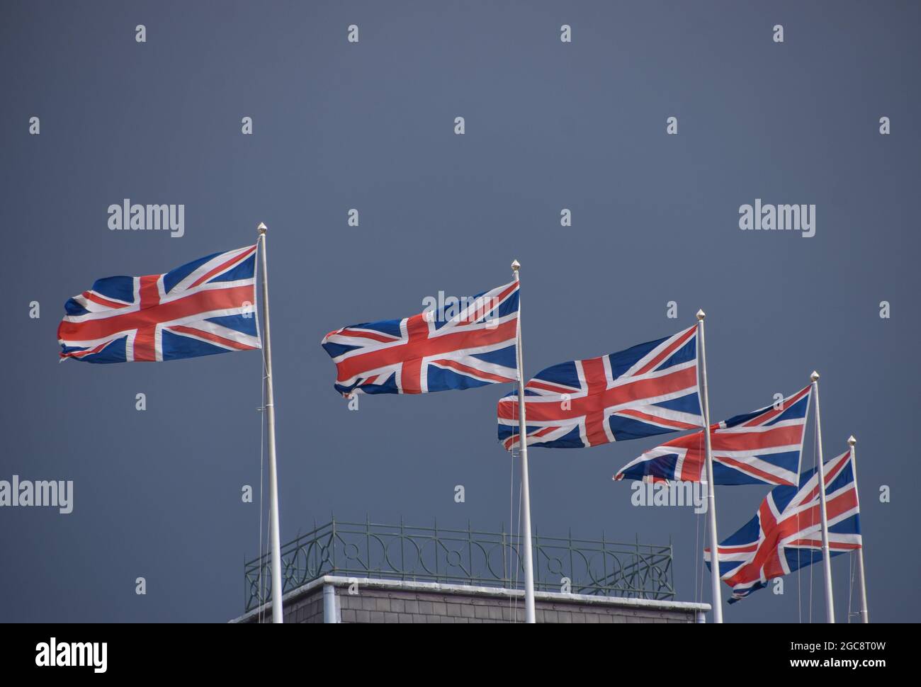 Multiple Union Jack flags with grey sky detail. London, UK Stock Photo Alamy