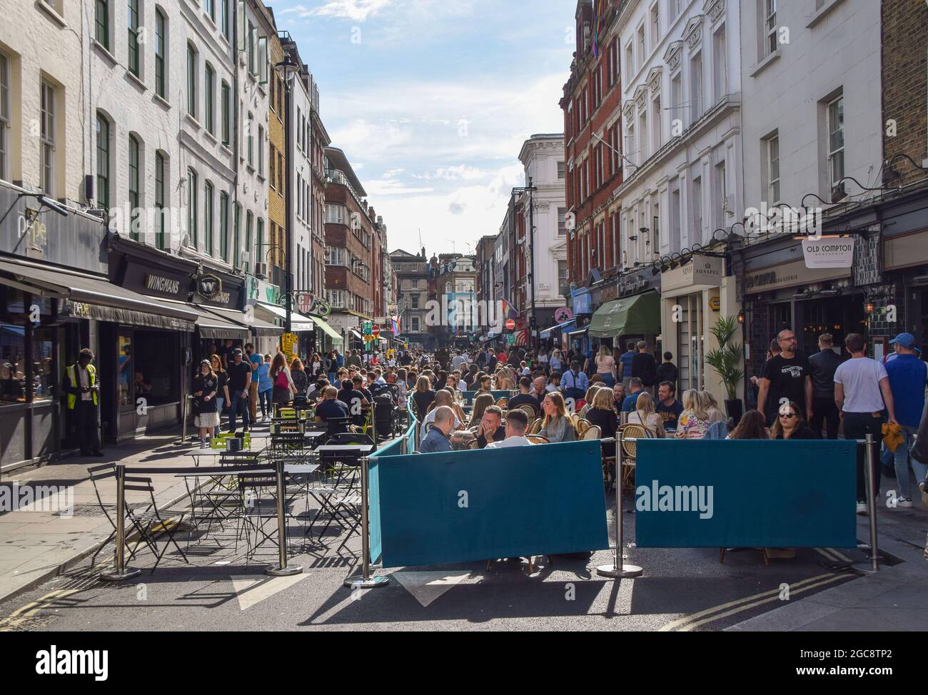 London, United Kingdom. 7th August 2021. Busy Old Compton Street. People flocked to bars and restaurants in Soho to enjoy the sunshine after a morning of heavy rain showers . (Credit: Vuk Valcic / Alamy Live News) Stock Photo