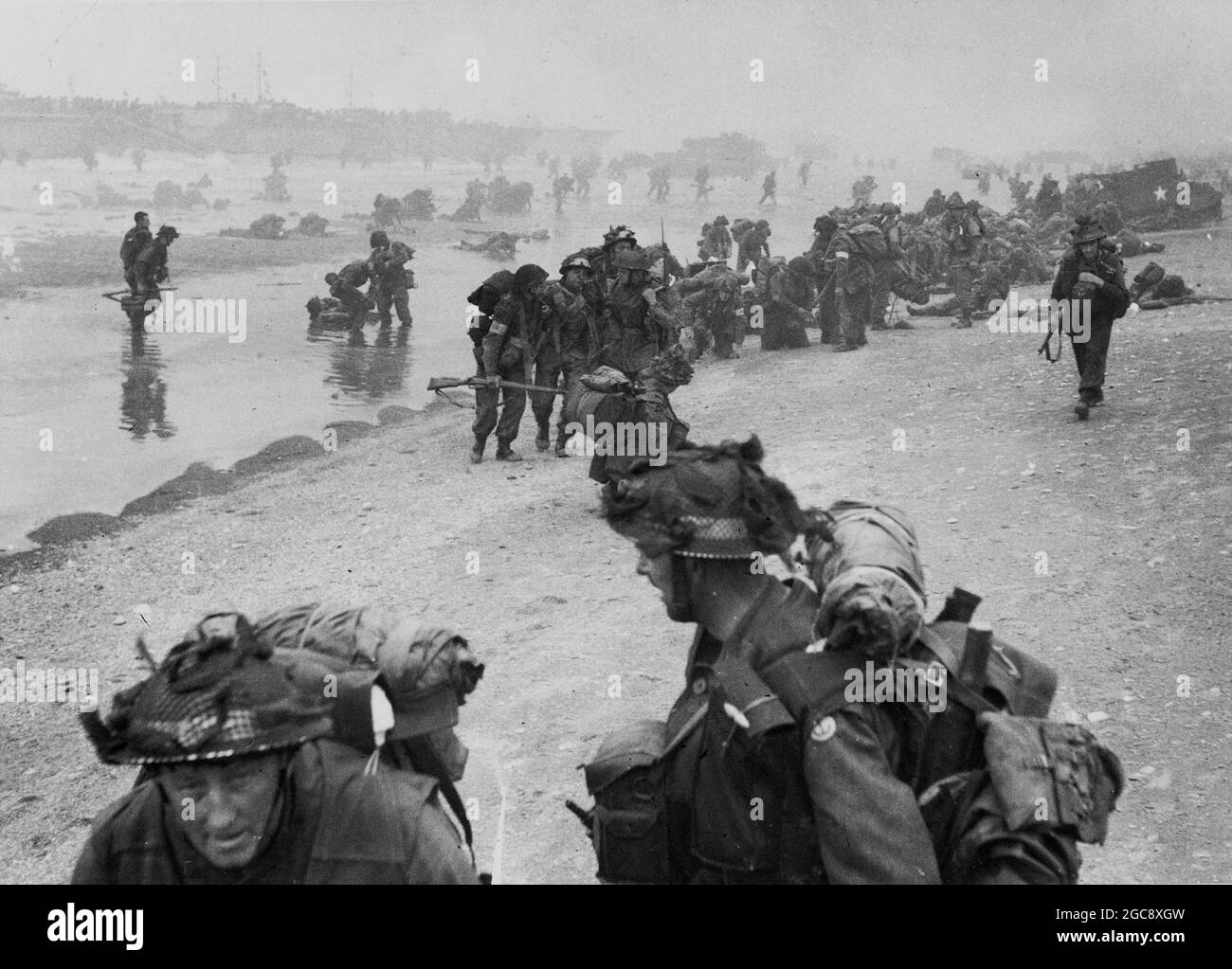 SWORD BEACH, NORMANDY, FRANCE - 06 June 1944 - British troops on Queen Beach, Sword Area at approx. 8:30am 6th June 1944. Soldiers of No.1 Platoon, 84 Stock Photo