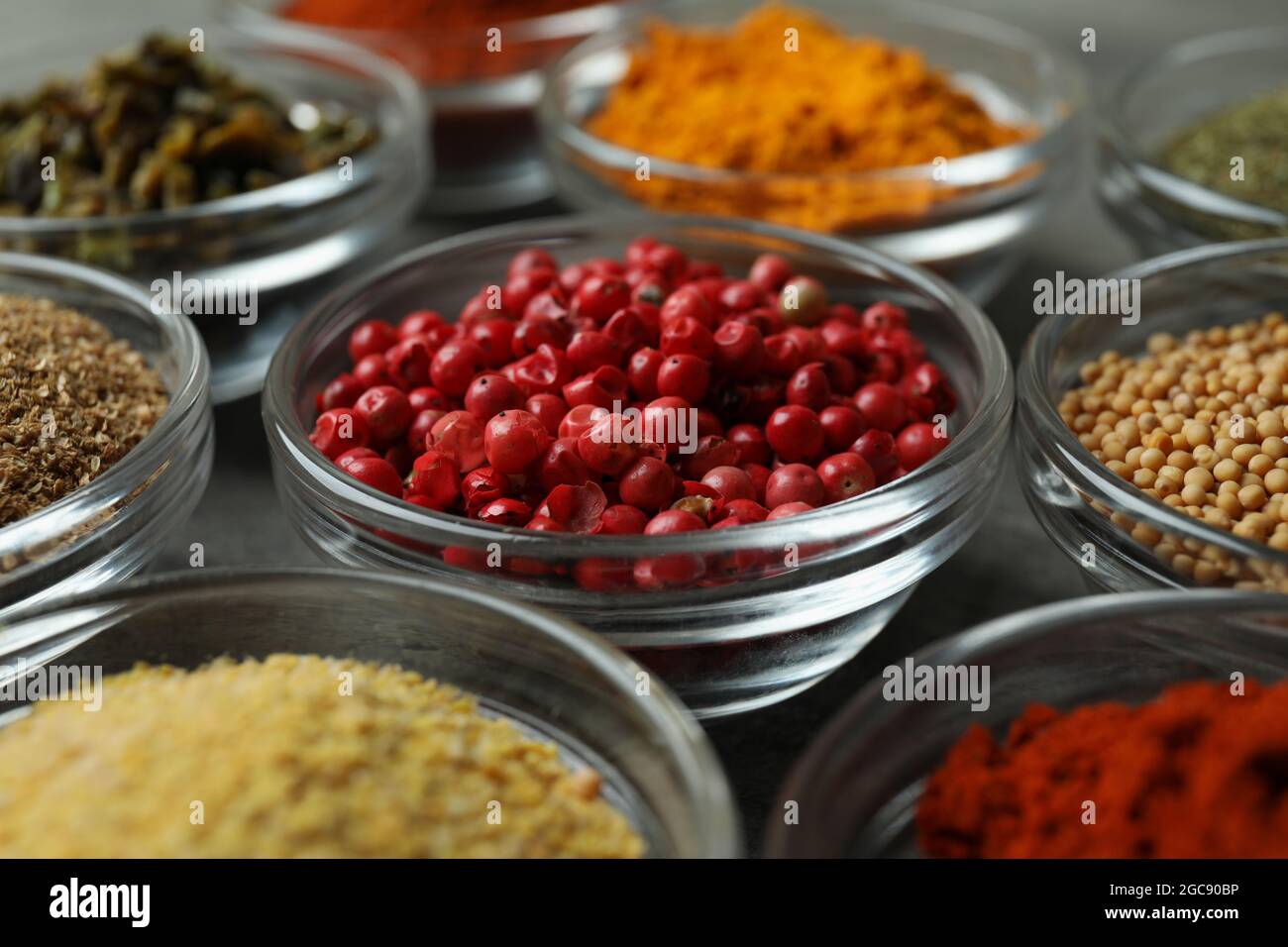Set of different spices in glass bowls Stock Photo