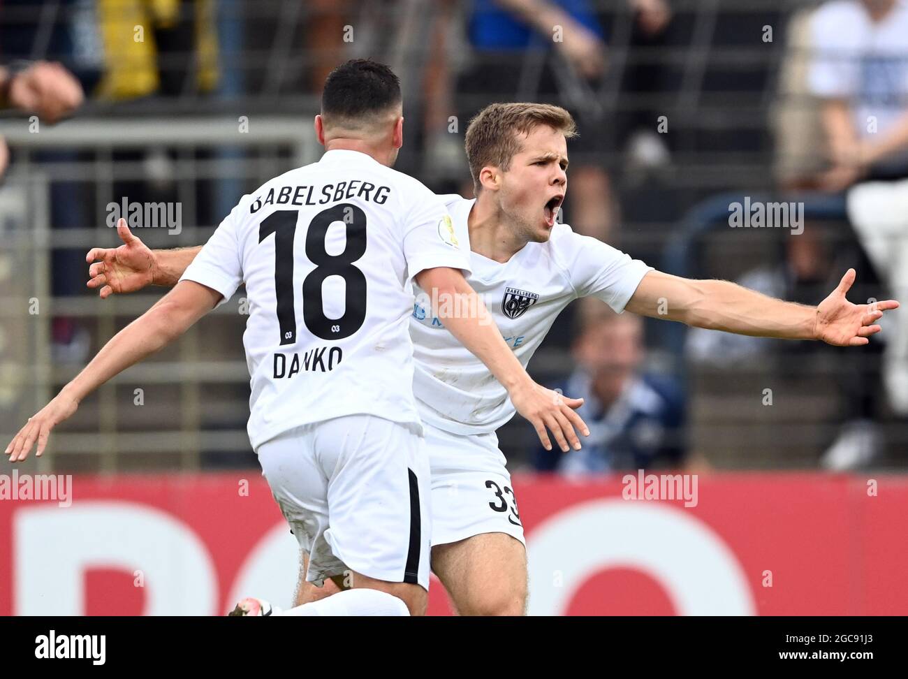 Potsdam, Germany. 07th Aug, 2021. Football: DFB Cup, SV Babelsberg 03 -  SpVgg Greuther Fürth, 1st round at Karl Liebknecht Stadium. David Danko (l)  and Robin Müller of Babelsberg celebrate after the