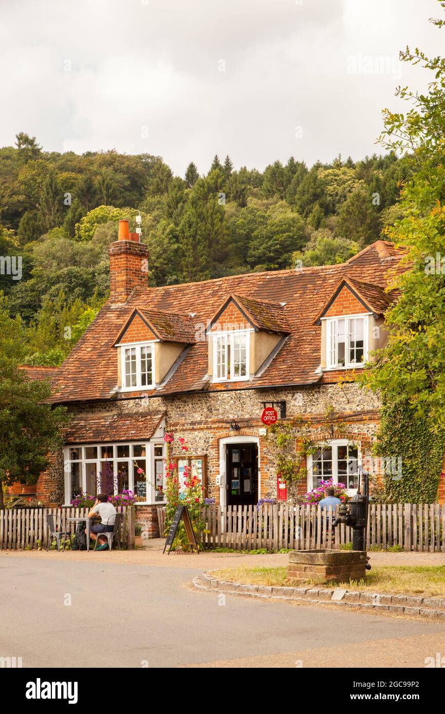 The village post office shop and café at the picturesque Chilterns Buckinghamshire village of Hambleden  with its village green and water pump Stock Photo
