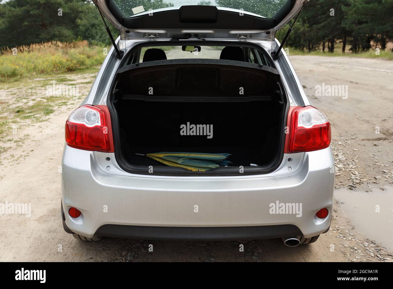 Silver color car with an open trunk Stock Photo Alamy