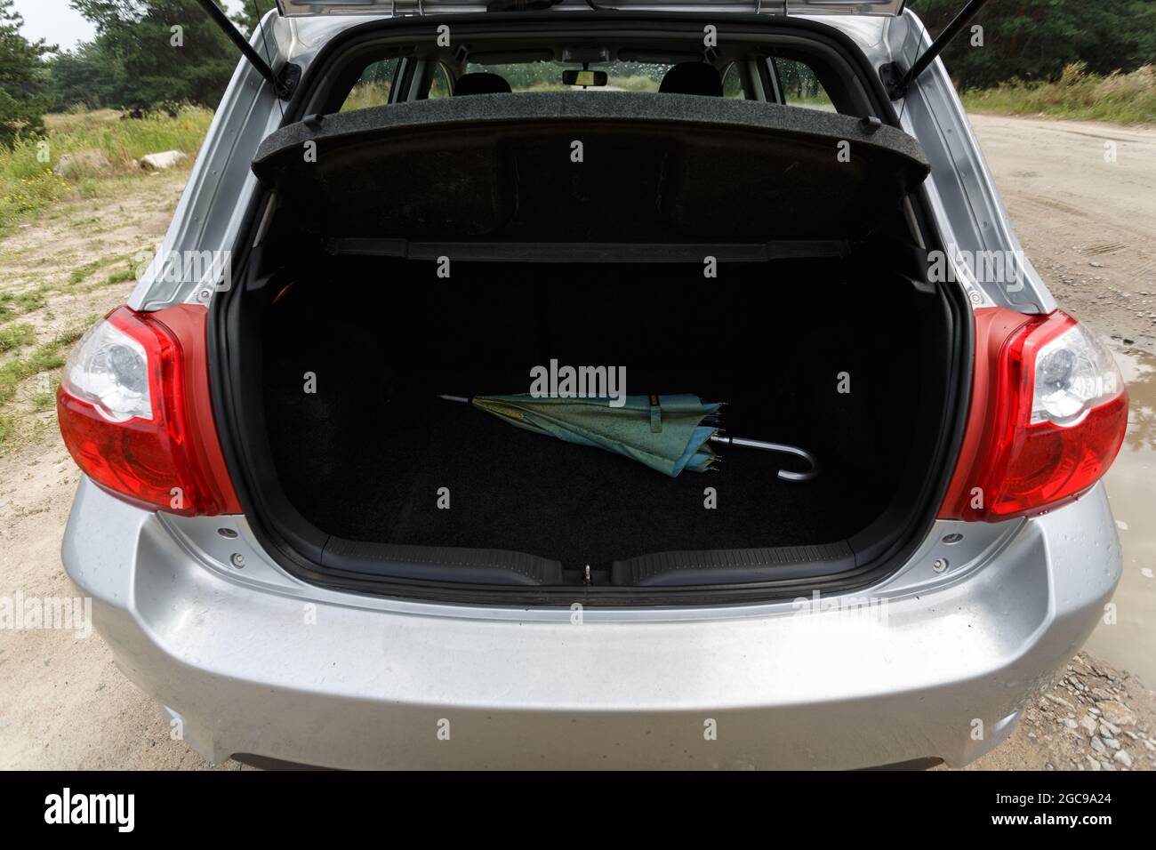 Silver color car with an open trunk Stock Photo
