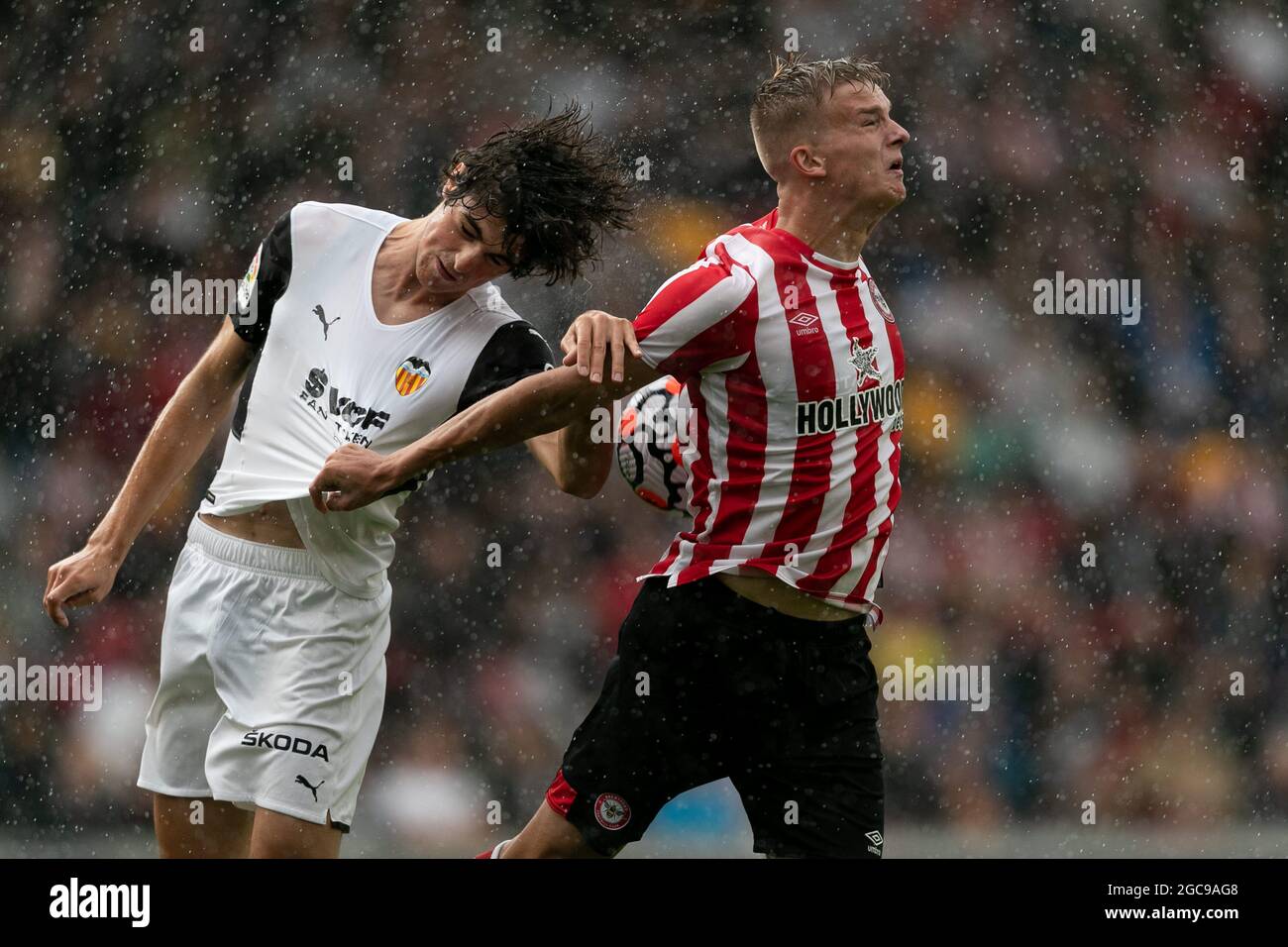 LONDON, UK. AUG 7TH: Kristoffer Ajer of Brentford and Jesus Vazquez of Valencia battle for the ball during the Pre-season Friendly match between Brentford and Valencia CF at the Brentford Community Stadium, Brentford on Saturday 7th August 2021. (Credit: Juan Gasparini | MI News) Credit: MI News & Sport /Alamy Live News Stock Photo