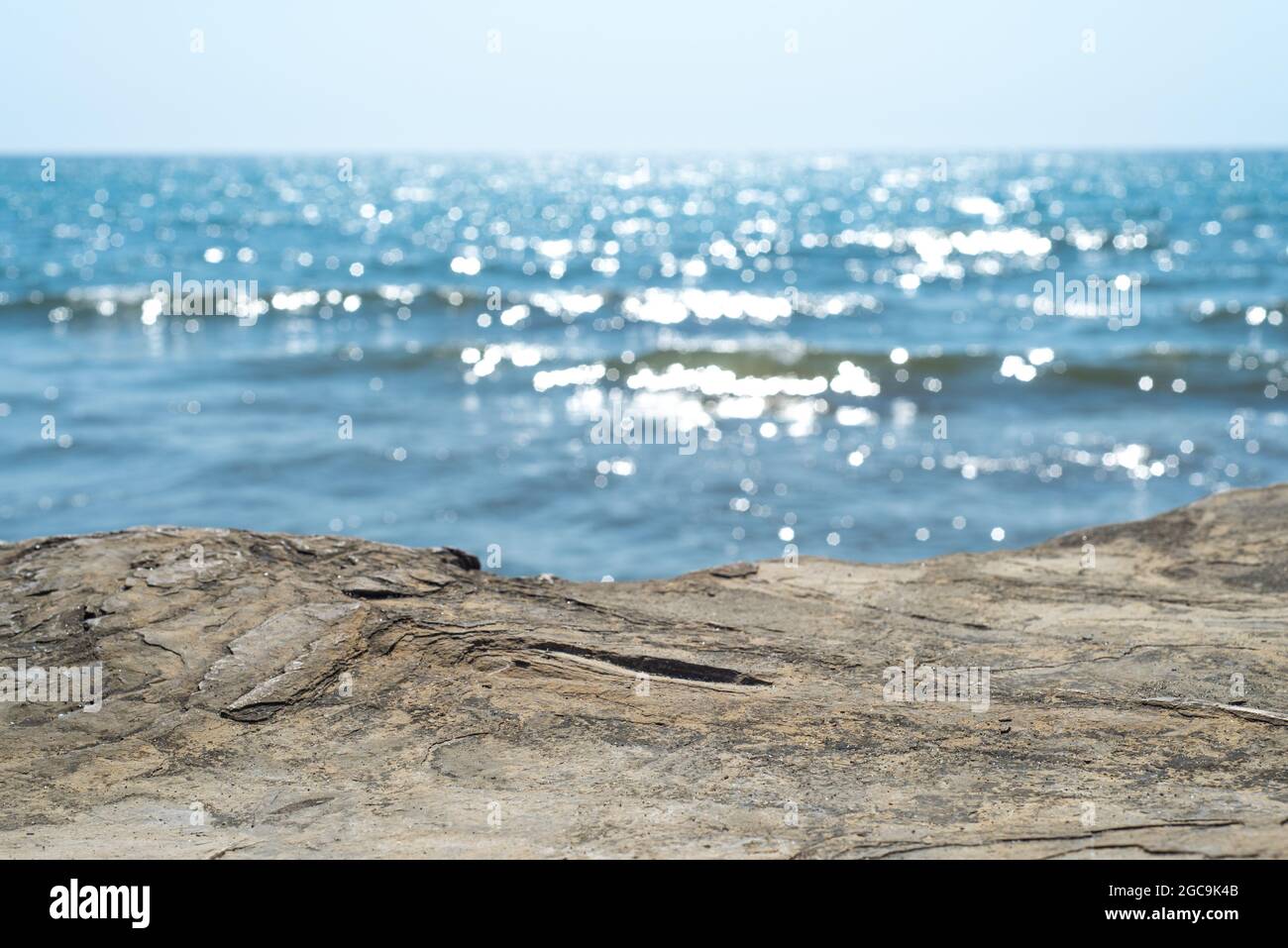 Empty cliff stone with summer blue sea blur background. Copy space for display of product on online media Stock Photo