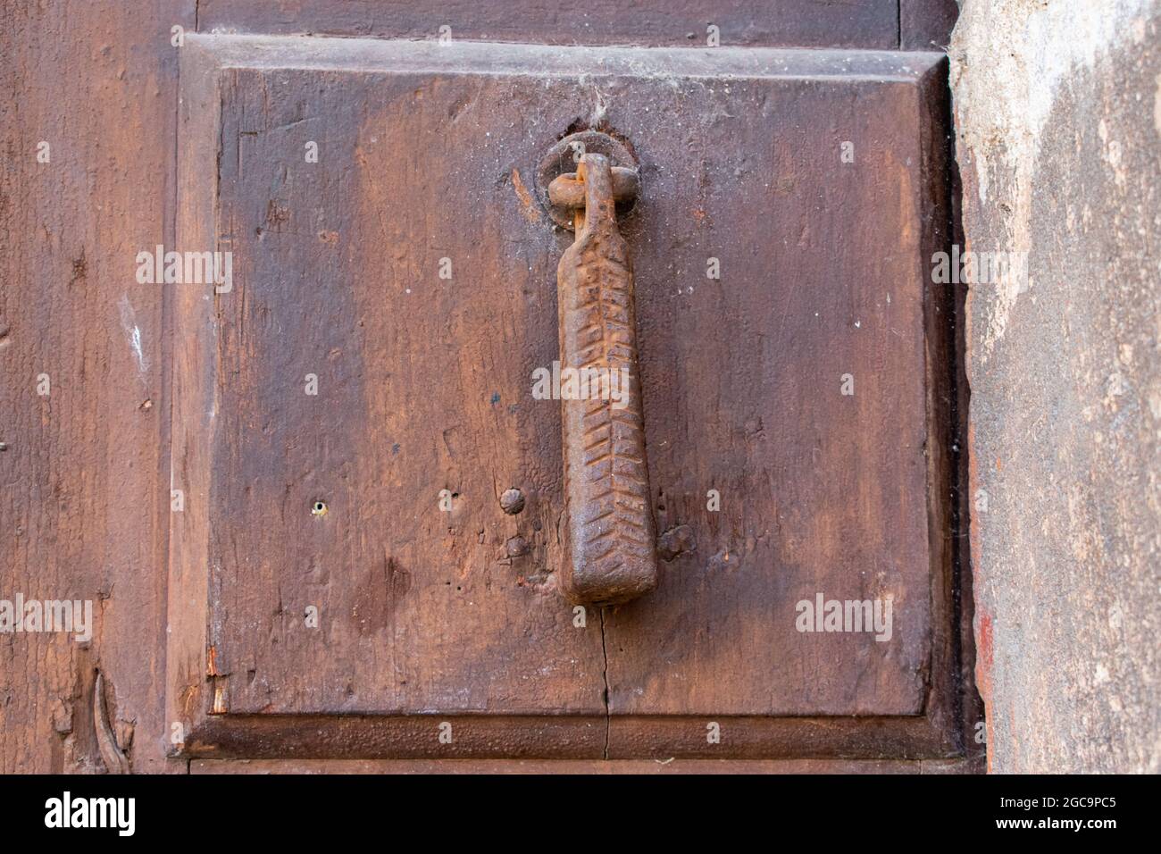 Close up of an old wooden vintage door with a sticking lock Stock Photo ...