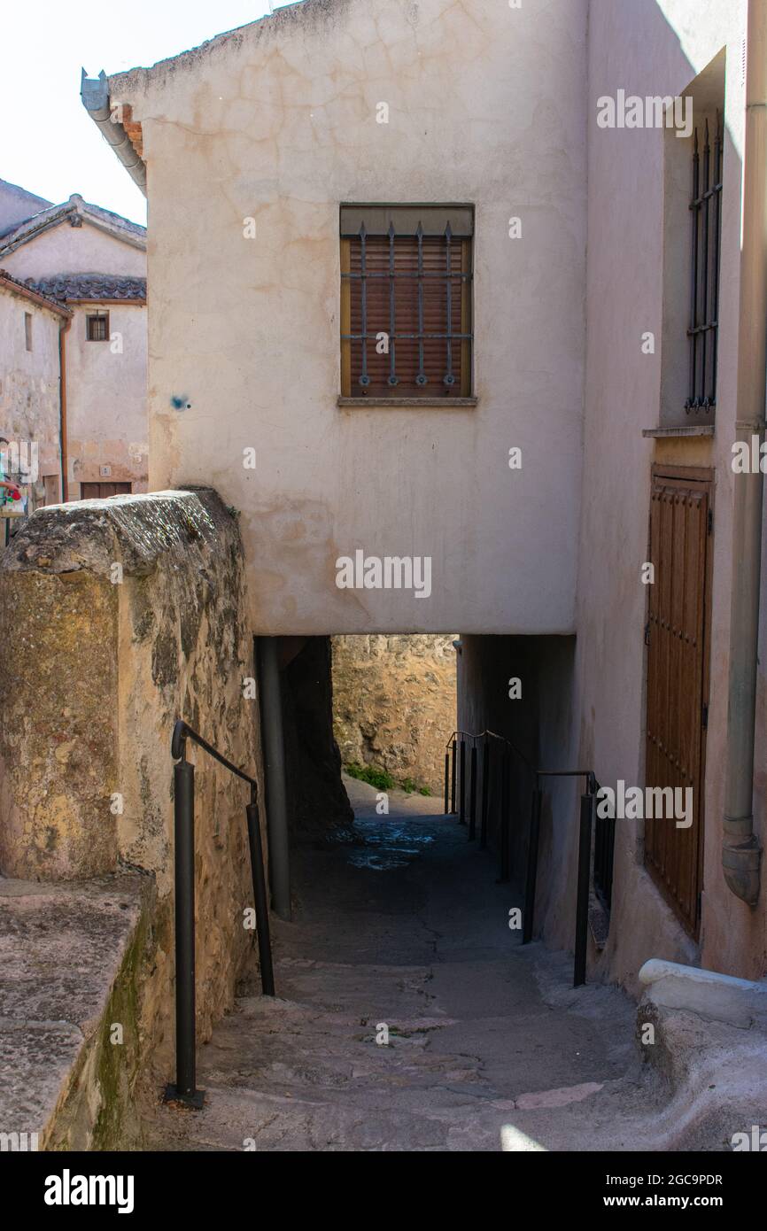 Vertical shot of an old neighborhood with a narrow path Stock Photo - Alamy