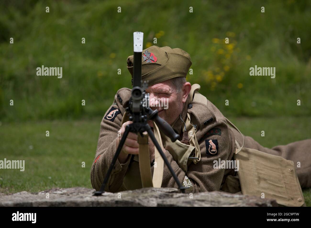 1st August 2021. Castle Rising, Norfolk, UK. Soldiers Through the Ages event at Castle Rising, the first public event at the 12th Century castle since before the Covid pandemic outbreak. Chris Page in full 1st Battalion Kings Royal rifle Corps uniform and armed with a MKI (1941), in honour of his late father who served with the battalion during the Second World War. Stock Photo