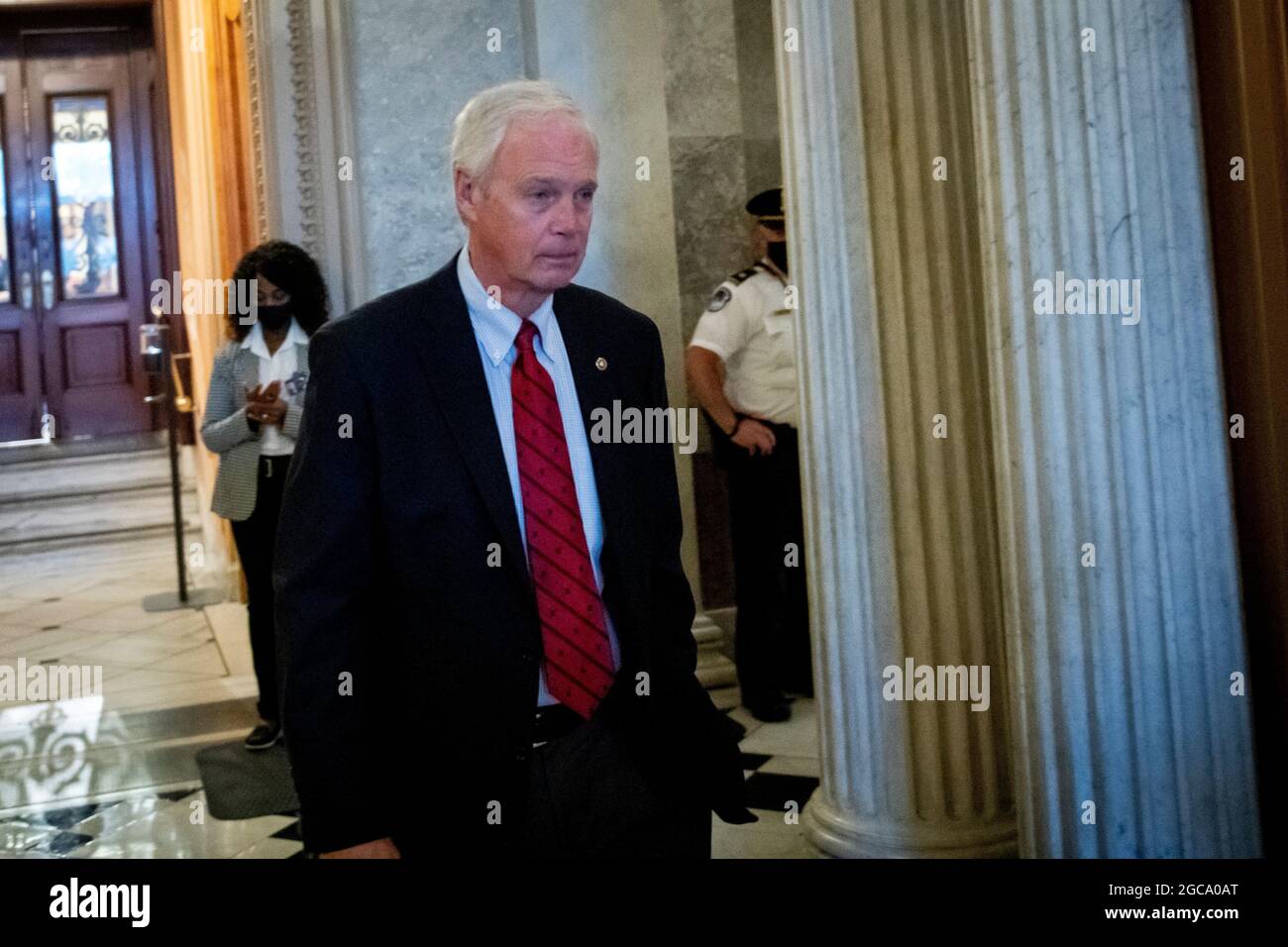 Washington, Vereinigte Staaten. 07th Aug, 2021. United States Senator Ron Johnson (Republican of Wisconsin) departs the Senate chamber during a vote at the US Capitol in Washington, DC, Saturday, August 7, 2021. Credit: Rod Lamkey/CNP/dpa/Alamy Live News Stock Photo
