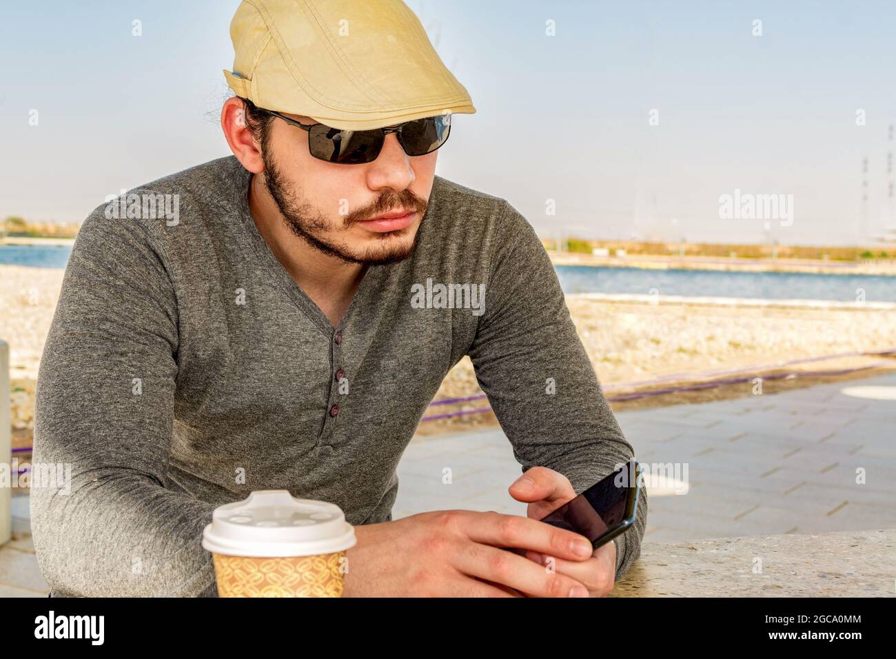 Serious adult man using hi-res stock photography and images - Alamy
