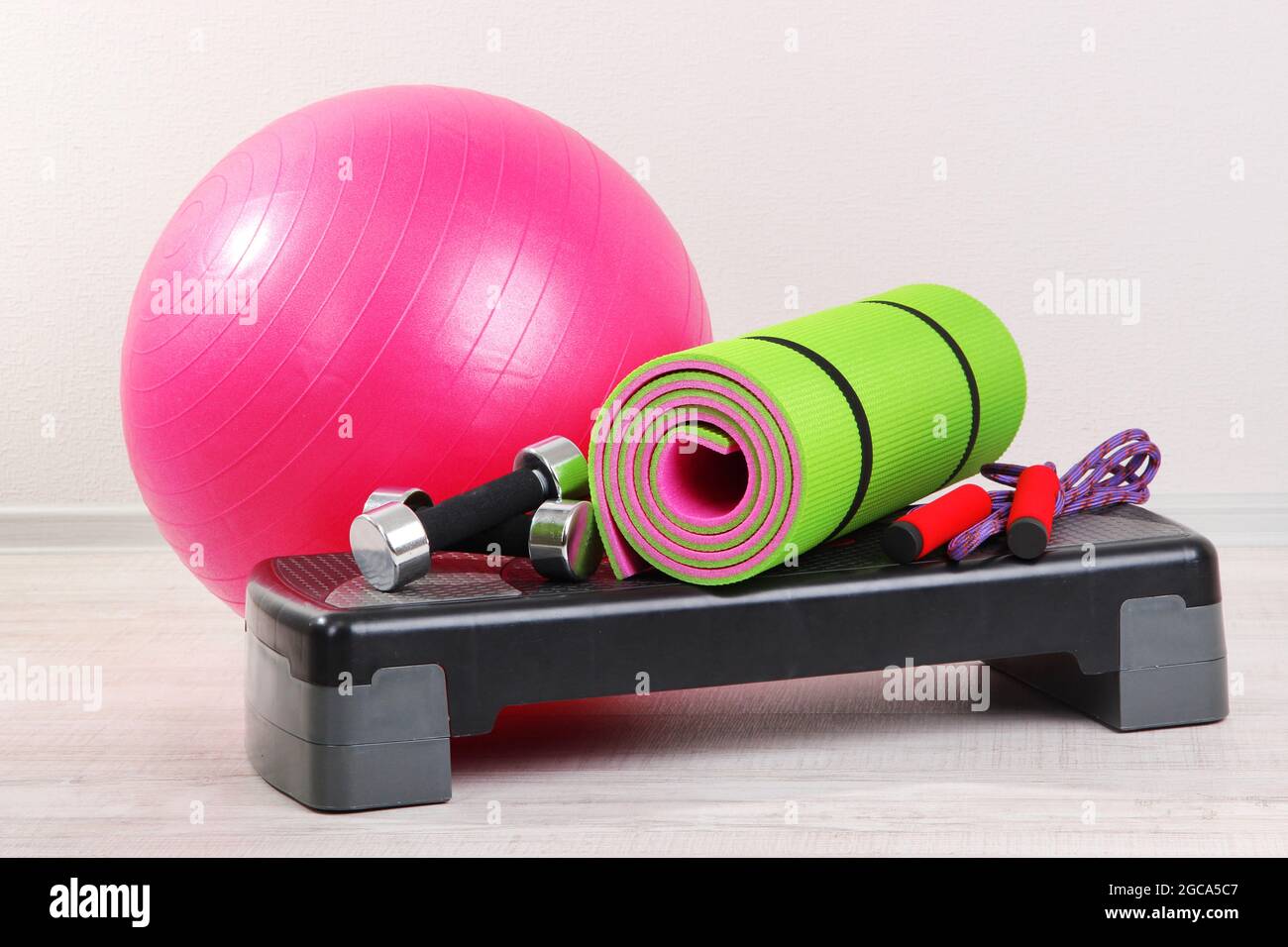 Different tools for fitness in room Stock Photo - Alamy